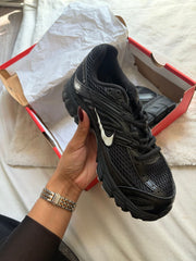 Black Nike running in its box